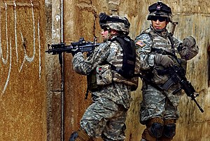Two US Army soldiers during a patrol through Sadr City in February 2006