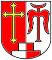 Gemeinde Inningen Über drei, eins zu zwei gestellten und von Silber und Rot gespaltenen Backsteinen, gespalten von Rot und Silber, vorne ein goldenes Kleeblattkreuz, hinten der rote Großbuchstaben M.