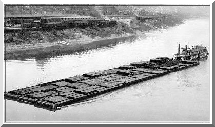Paddlewheel tow boat Sprague, the largest river steamboat in the world, towing 50,000 tons of coal in barges.[1]