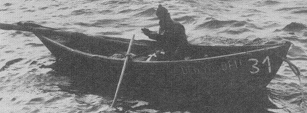 A small wooden dory used for bringing fish back to the Gazela