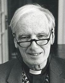 Elderly priest with spectacles and clerical collar