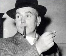 Pierrepoint, wearing a hat, and about to light a cigar