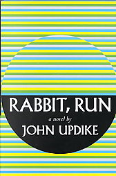 an abstract patterning of yellow, green, white, and light blue lines. In a black half-circle the text “ Rabbit, Run a novel by John Updike” appears.