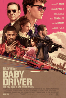Theatrical release poster, featuring the principal cast superimposed on an urban streetscape backdrop of Atlanta. The words "Baby Driver" are written in the foreground.
