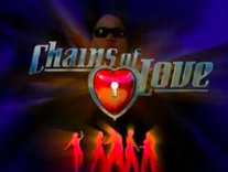 The words "Chains of Love" in front of the silhouettes of five figures and a CGI-model of a man wearing dark sunglasses