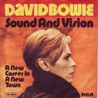 The cover art for David Bowie's 1977 single "Sound and Vision", featuring a profile of Bowie with the words "David Bowie Sound and Vision" in big letters, the title "A New Career in a New Town" to his left, and "RCA" in the bottom right hand corner