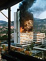 Image 73Executive council building burns in Sarajevo after being hit by Bosnian Serb artillery in the Bosnian War. (from 1990s)