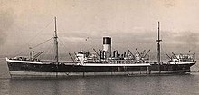 Sepia-toned image of a ship in open waters with a smokestack at center and two masts on either side of the funnel.