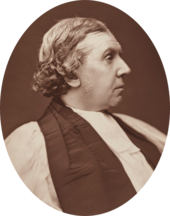 stout, clean-shaven white man in clerical dress