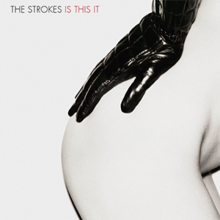 Mostly white album cover containing, largely in the right-hand side, a woman's nude right bottom and hip, with a black leather-gloved hand resting on it. It is captioned "THE STROKES IS THIS IT" in the top left-hand corner.