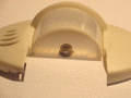 PIR motion detector housing with cylindrical faceted window. The animation highlights individual facets, each of which is a Fresnel lens, focusing light on the sensor element underneath.