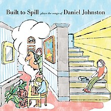 The interior of a house drawn in a cartoon style. In the front left, a person plays the piano, from which a thought bubble flows, in which a person is riding a horse. To the right, a person sits on stairs.