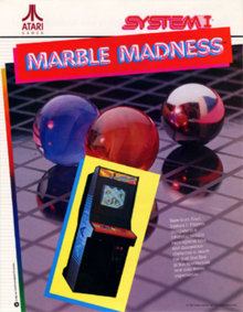 Artwork of a vertical rectangular advertisement flyer. Pictured is an image of an arcade cabinet in front of an image of red, blue, and silver marbles on a gridded plane. The top left corner displays the Atari logo, while the top right corner reads "System I". Below the logo reads "Marble Madness".