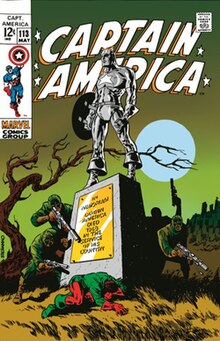 A comic book cover featuring an illustration of the grave of Captain America. A figure dressed as Captain America's sidekick Bucky Barnes weeps at its base, while several men holding guns flank outwards from behind it.