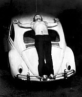 Chris Burden's 1974 performance piece Trans-Fixed, in which he is crucified on a Volkswagen