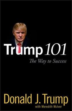 The book's title and authors are written on a black background, with a small portrait image of Trump above the letter "u" in the title.