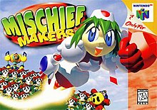 A female robot named Marina Liteyears is blasting toward the right side of the box art, with fist outstretched and a trail of fire behind her. On the ground is a legion of identical, sad-faced creatures. The logo is in big, green bubble letters, and the Nintendo 64 sidebar flanks on the right.