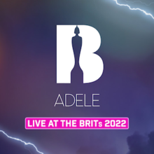 The white text "B Adele" and "Live at the Brits 2022", the latter highlighted in shocking pink, afront a dark sky and lightning background. The "B" is hollowed out by the silhouette of a Brit award.