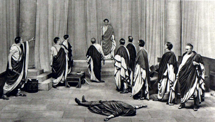 stage scene with actors in Roman togas