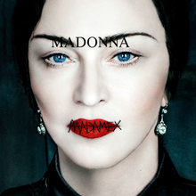 A dark-haired Madonna looking directly into the camera, with the Madame X logo printed on top of her lips.