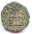 A tree and swastika coin