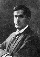 photograph of a youngish white man, dark haired and clean shaven