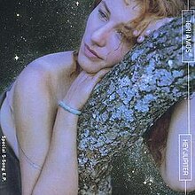 Hey Jupiter US EP cover art featuring Tori Amos staring into the distance leaning on a tree branch