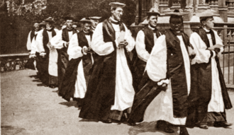 Long procession of mostly white clergymen in episcopal costume
