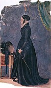 Emma Smith stands in profile wearing a black riding habit and carrying a riding whip