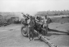 A black and white image of a New Zealand howitzer during Operation Coburg