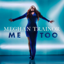 A red-haired woman stands in front of a bright blue background, wearing a navy blue dress. She looks up and spreads her arms out. Both the artist and song's name are superimposed on the cover.