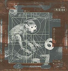 A monkey surrounded by lines forming geometric shapes. The border of the image is brown, and "Pixies" is printed in the upper-right corner