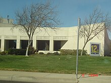 A one-story office building with KCOY-TV signage