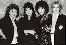 A black-and-white promotional image of The Forester Sisters, showing all four members of the group