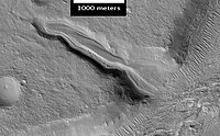 Layered deposit in the Mamers Valles, as seen by HiRISE.