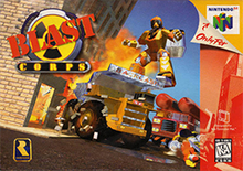 Traditional Nintendo 64 box art with red-colored duotone overlay along the right side of the box. The console logo in the upper right, with an indication that the game is exclusive to the console, and the ESRB content rating in the lower right. The Blast Corps logo is in the upper left: a diagonal "BLAST" in red, capital letters, atop a yellow and black "toxic" symbol. The Rareware yellow and blue logo resembling the curve of the letter "R" is in the bottom left. The horizon of the background is slanted to the right: a trump truck is slamming into a building, a fiery explosion extends from the collision site, a polygonal humanoid figure hovers above the dump truck, and a red fire engine-like vehicle with two cylinders mounted atop approaches from the right.