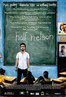 A man standing in front of a blackboard, the words "half nelson" written prominently in white chalk.