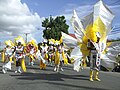 Parade of costumed carnival dancers.