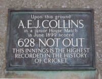 A plaque that reads: "Upon this ground // A. E. J. COLLINS // in a junior House Match // in June 1899 scored // 628 NOT OUT // THIS INNINGS IS THE HIGHEST // RECORDED IN THE HISTORY // OF CRICKET"