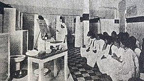 A dispensary nurse in Hanoi gives a lesson to sex workers on sexual hygiene, c. 1937.