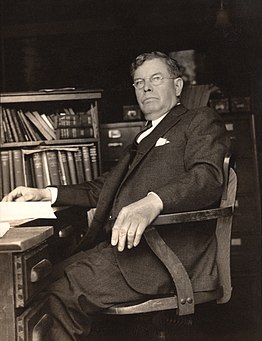 Image of Killam sitting at his desk in his office