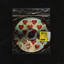 A blank CD decorated with red hearts in a plastic bag, with the word "Amo" and a barcode on a label next to it.