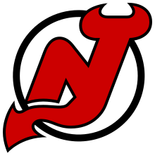 Inside a white circle with black borders, the letters "N" and "J" in red joined together, with the "J" having devil horns at the top and a pointed tail at the bottom.
