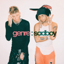 Two young men stand against a light background – MGK, at left, dressed in all black and Trippie Redd wearing a big funny hat.
