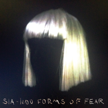 A blonde bobbed wig against a black background. Stylised along the bottom of the image are the words "Sia", and "1000 Forms of Fear".