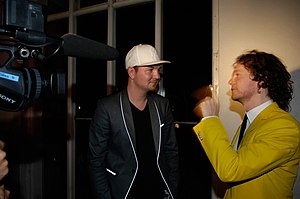 Torpe (right) and Kolsch/Rune RK (left) being interviewed backstage at a show in Copenhagen, Denmark on May 30, 2008.