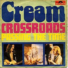 Photo of 1969 Italian picture sleeve with "Cream" in large stylized letters with "Crossroads" and "Passing the Time" beneath and smaller separate photos of Eric Clapton, Ginger Baker, and Jack Bruce playing their insruments