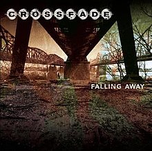A photo of a dirt channel under a bridge, colored in brown, green and orange. The band's logo appears on the top-left and the album title is placed on the right mid-center of the cover.