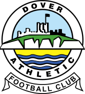 A simplified illustration of a castle atop white cliffs, with the sea below, all surrounded in a circular border containing the words "Dover Athletic", with a scroll below containing the words "Football Club"