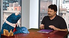 Double Fine founder Tim Schafer (right) and Cookie Monster (left) during a promotional video for Sesame Street: Once Upon a Monster